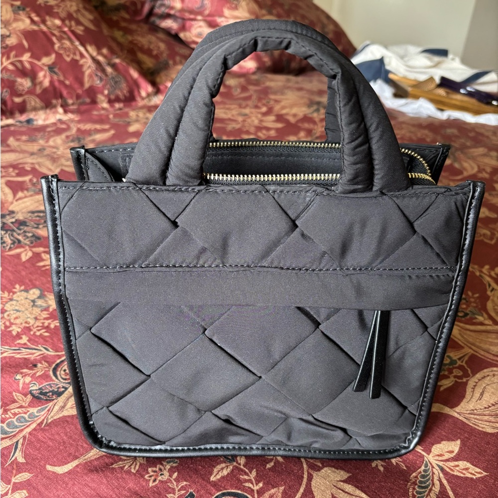 Quilted handbag with top handles and detachable cross body strap. EUC